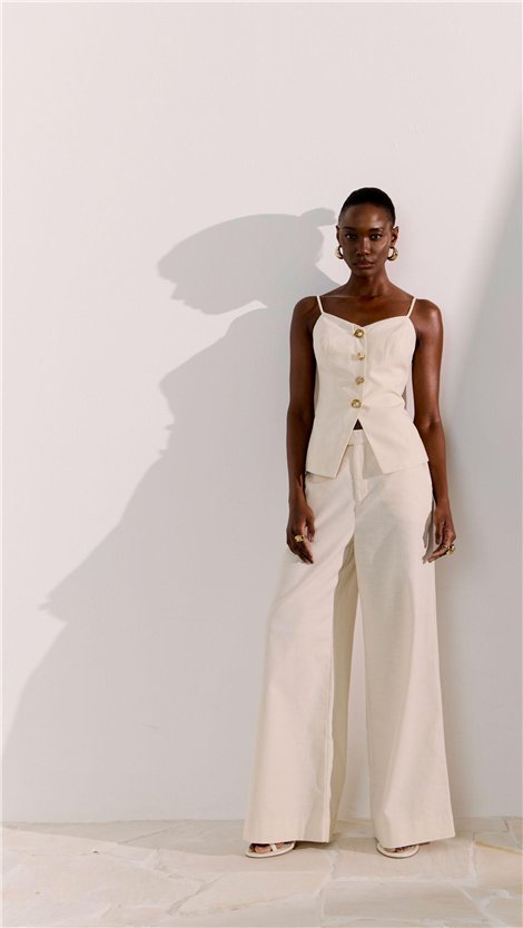 Perfume Pantalón de pernera ancha con detalle botón caracola